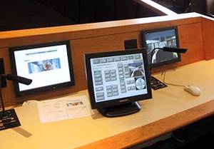 touch panel and desk monitors at head table